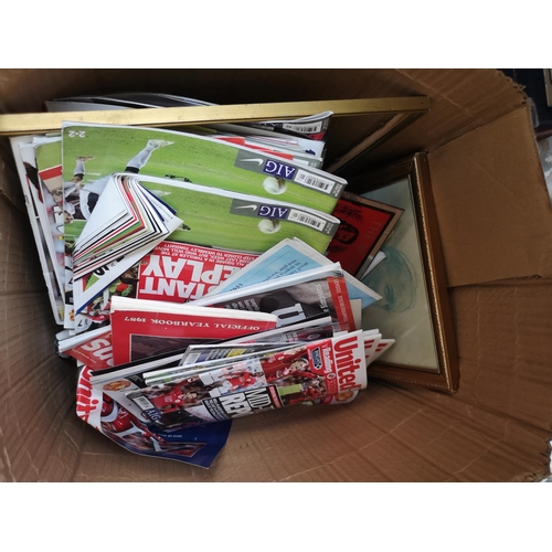 777 - Four boxes containing boxed Manchester United collectables, United Review programmes, three framed o... 