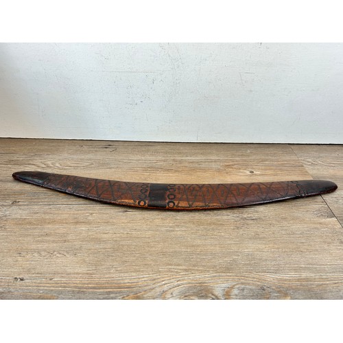 419 - Two pieces of late 19th/early 20th century aboriginal ephemera, carved boomerang and bow