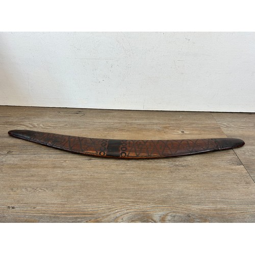 419 - Two pieces of late 19th/early 20th century aboriginal ephemera, carved boomerang and bow