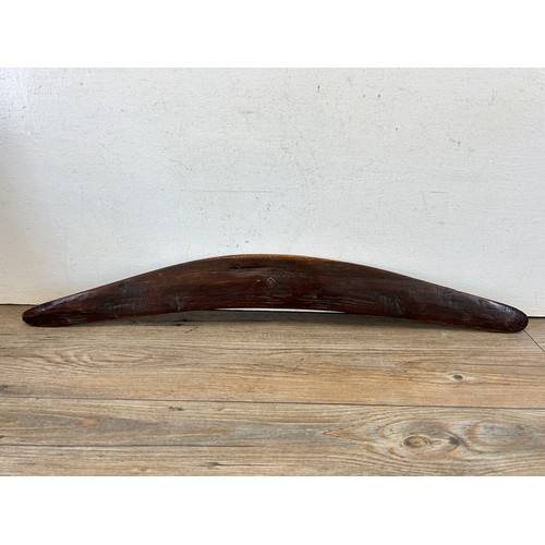 419 - Two pieces of late 19th/early 20th century aboriginal ephemera, carved boomerang and bow