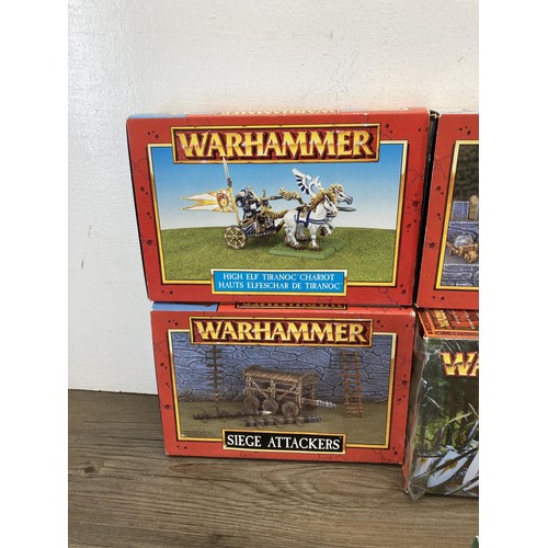 336 - A collection of Warhammer figurines to include High Elf Silver Helms, Siege Defenders, Siege Attacke... 