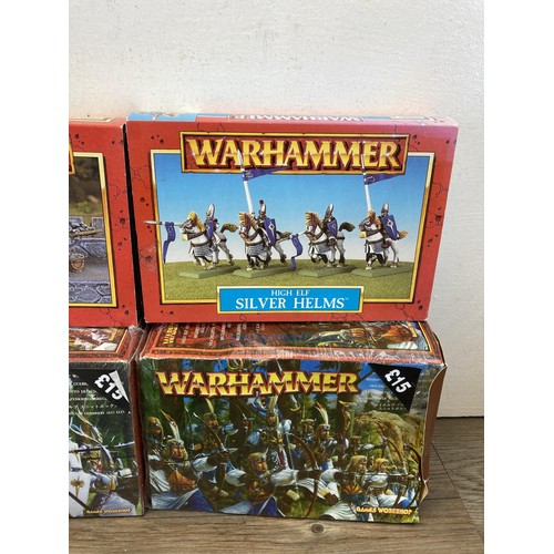 336 - A collection of Warhammer figurines to include High Elf Silver Helms, Siege Defenders, Siege Attacke... 