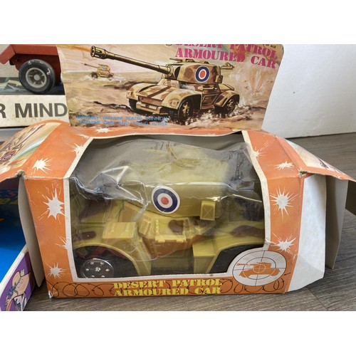 338 - A collection of vintage toys and games to include Vic-toy Master Mind, Jimson no. 60008 friction pow... 