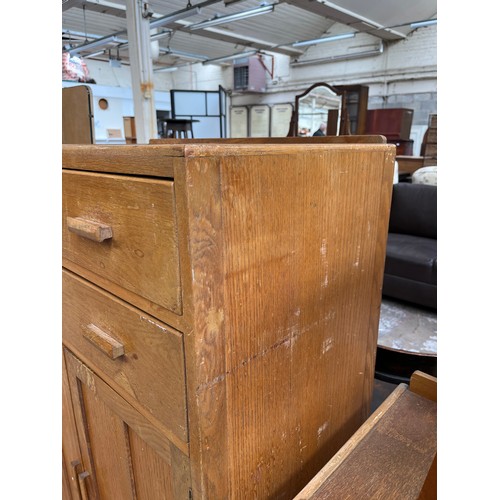 109 - A 1940s oak tall boy with two drawers and two cupboard doors - approx. 123cm high x 83.5cm wide x 47... 