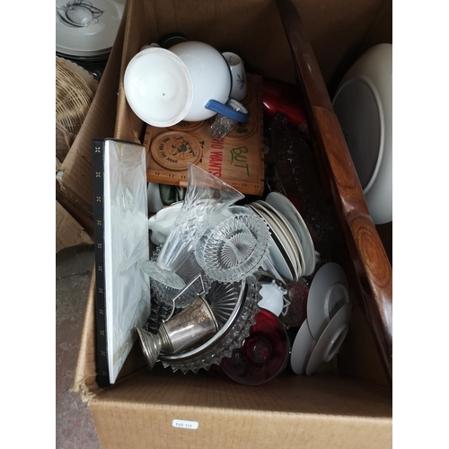 785 - Four boxes and a wicker laundry basket containing cutlery, kitchenware, brassware and ceramics to in... 