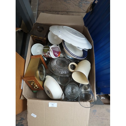 784 - Four boxes containing glassware, clock, cushion, DAB clock radio and ceramics to include Haddon, Poo... 