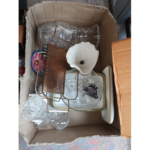 784 - Four boxes containing glassware, clock, cushion, DAB clock radio and ceramics to include Haddon, Poo... 