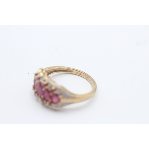 1002 - A 9ct gold ruby and diamond set cluster cocktail ring, size P½ - approx. gross weight 3.3 grams