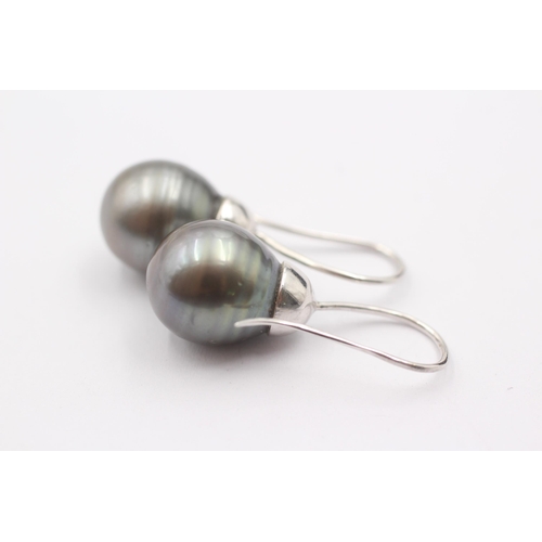 1006 - A pair of 9ct white gold black pearl drop earrings - approx. gross weight 8.7 grams