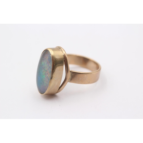 1007 - A 9ct gold opal cocktail ring, size M½ - approx. gross weight 6 grams