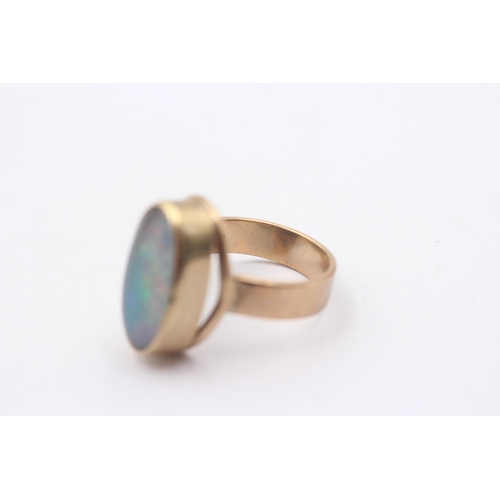 1007 - A 9ct gold opal cocktail ring, size M½ - approx. gross weight 6 grams