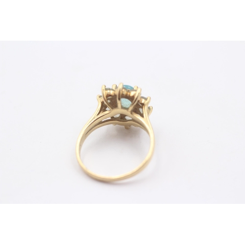 1011 - A 9ct gold blue paste cluster ring - approx. gross weight 3.3 grams