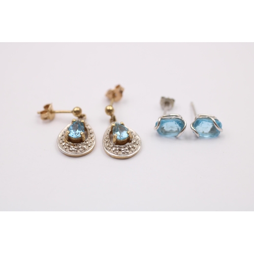 1013 - Two pairs of 9ct gold topaz earrings, one white gold and one yellow gold with diamonds - approx. gro... 