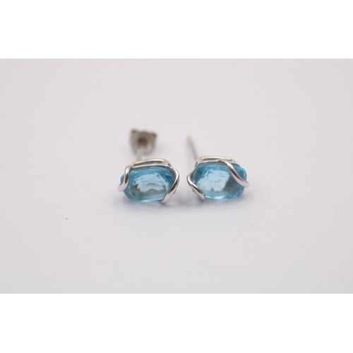 1013 - Two pairs of 9ct gold topaz earrings, one white gold and one yellow gold with diamonds - approx. gro... 