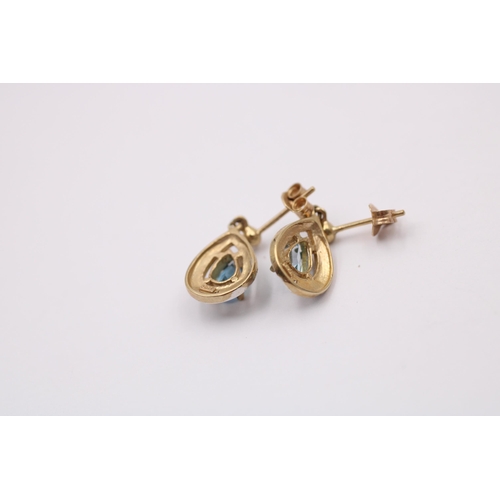 1013 - Two pairs of 9ct gold topaz earrings, one white gold and one yellow gold with diamonds - approx. gro... 