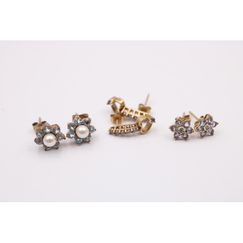 1016 - Three pairs of 9ct gold earrings, one tanzanite, one diamond and tanzanite and one cultured pearl an... 