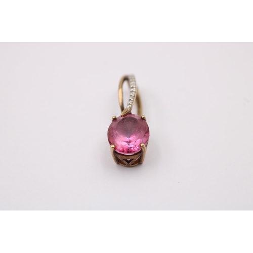 1017 - Two 9ct gold diamond and gemstone set pendants, one citrine and one coated pink topaz - approx. gros... 