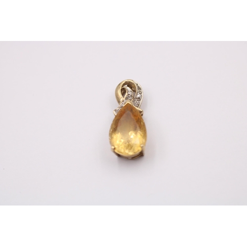 1017 - Two 9ct gold diamond and gemstone set pendants, one citrine and one coated pink topaz - approx. gros... 