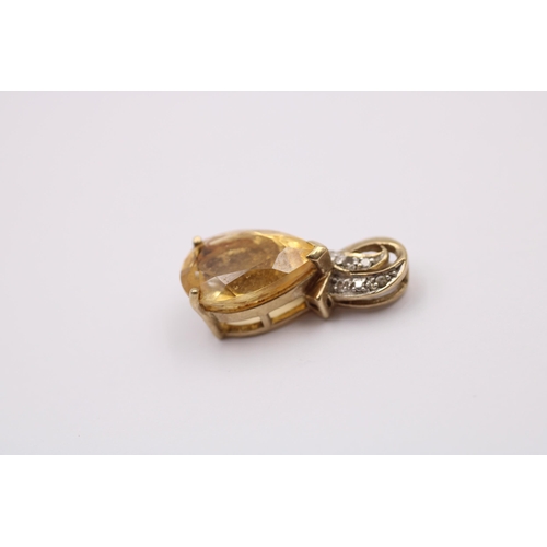 1017 - Two 9ct gold diamond and gemstone set pendants, one citrine and one coated pink topaz - approx. gros... 