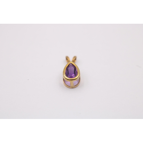 1018 - Three 9ct gold gemstone pendants, one blue topaz, one amethyst, and one peridot - approx. gross weig... 