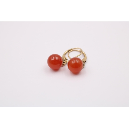 1082 - A pair of 9ct gold carnelian drop earrings - approx. gross weight 2.6 grams