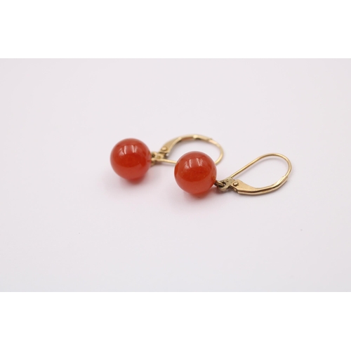 1082 - A pair of 9ct gold carnelian drop earrings - approx. gross weight 2.6 grams