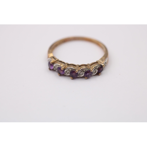 1087 - A 9ct gold diamond and amethyst eleven stone ring - approx. gross weight 2.1 grams