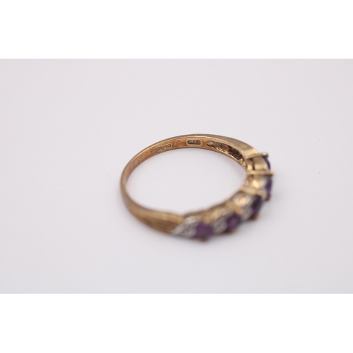 1087 - A 9ct gold diamond and amethyst eleven stone ring - approx. gross weight 2.1 grams