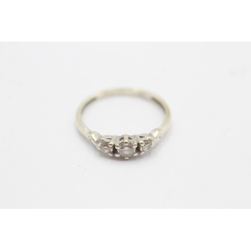 1088 - A 9ct white gold diamond graduated trilogy ring, size L - approx. gross weight 1.3 grams