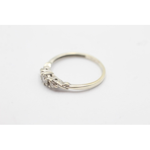 1088 - A 9ct white gold diamond graduated trilogy ring, size L - approx. gross weight 1.3 grams