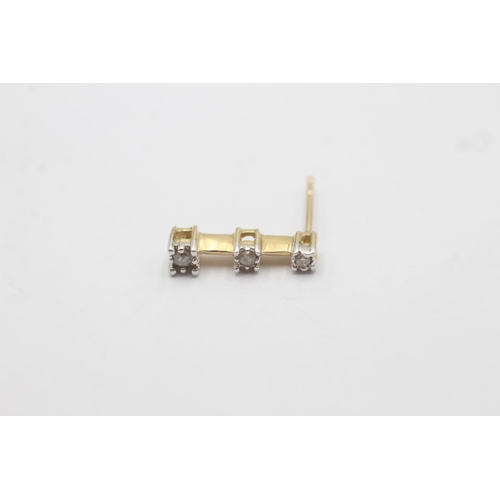 1092 - A pair of 10ct white and yellow gold diamond trilogy column stud earrings - approx. gross weight 1.3... 