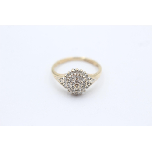 1094 - A 9ct gold diamond cluster and shoulder set statement ring - approx. gross weight 2.4 grams