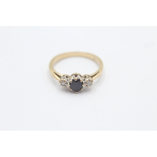 1095 - A 9ct gold diamond and sapphire graduated trilogy ring, size L½ - approx. gross weight 2 grams