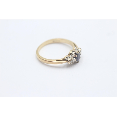 1095 - A 9ct gold diamond and sapphire graduated trilogy ring, size L½ - approx. gross weight 2 grams