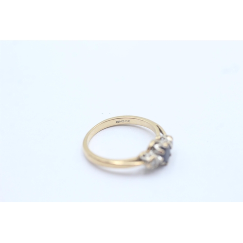 1095 - A 9ct gold diamond and sapphire graduated trilogy ring, size L½ - approx. gross weight 2 grams