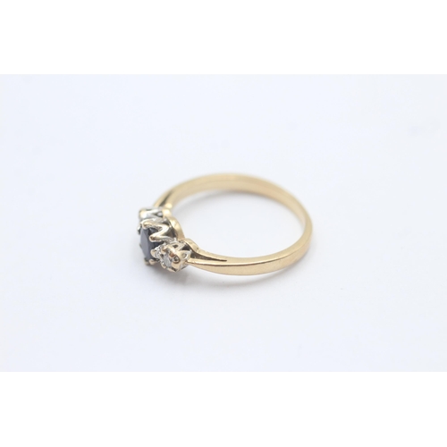 1095 - A 9ct gold diamond and sapphire graduated trilogy ring, size L½ - approx. gross weight 2 grams