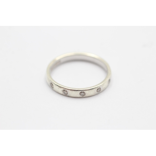 1101 - A 9ct white gold diamond flash set half eternity ring - approx. gross weight 2.6 grams