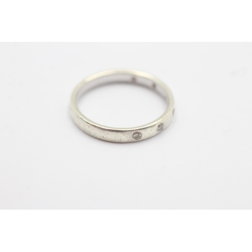 1101 - A 9ct white gold diamond flash set half eternity ring - approx. gross weight 2.6 grams