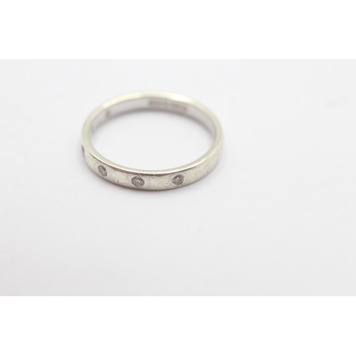 1101 - A 9ct white gold diamond flash set half eternity ring - approx. gross weight 2.6 grams