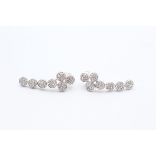 1102 - A pair of 9ct white gold diamond set cluster drop earrings - approx. gross weight 3 grams