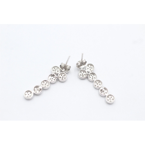 1102 - A pair of 9ct white gold diamond set cluster drop earrings - approx. gross weight 3 grams