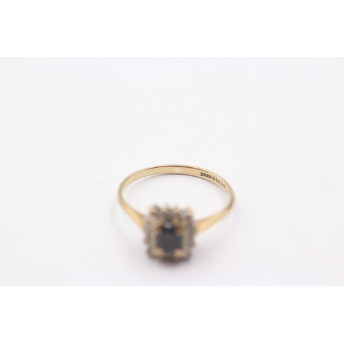 1104 - A 9ct gold diamond and sapphire set cluster ring, size N½ - approx. gross weight 1.8 grams