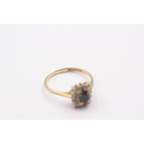 1104 - A 9ct gold diamond and sapphire set cluster ring, size N½ - approx. gross weight 1.8 grams