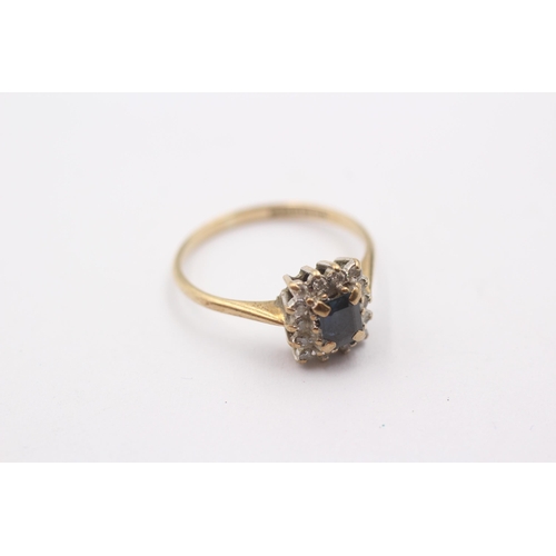 1104 - A 9ct gold diamond and sapphire set cluster ring, size N½ - approx. gross weight 1.8 grams