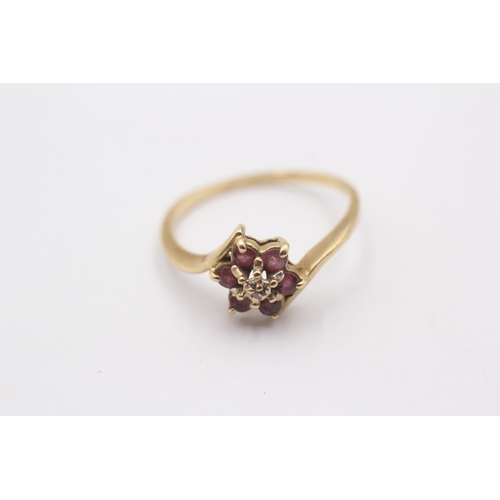 1106 - A 9ct gold ruby and diamond set cluster ring - approx. gross weight 1.6 grams