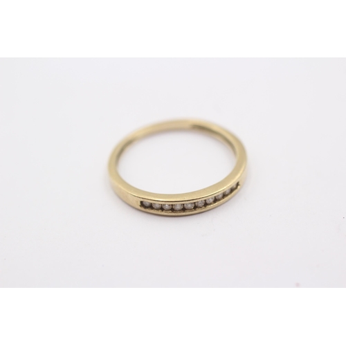 1111 - A 9ct gold channel set diamond ring - approx. gross weight 1.2 grams