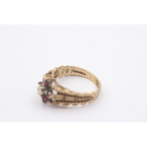 1118 - A 9ct gold ruby and diamond set floral cluster ring - approx. gross weight 3.4 grams