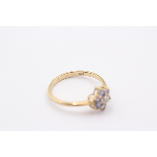 1120 - A 9ct gold tanzanite and diamond set floral cluster ring - approx. gross weight 1.8 grams