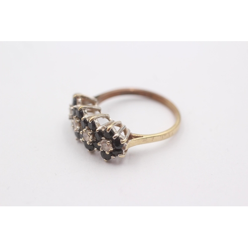 1124 - A 9ct gold sapphire and white gemstone set cluster ring, size L½ - approx. gross weight 2.4 grams