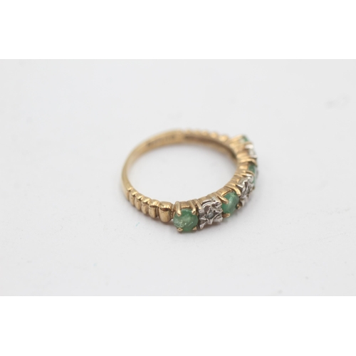 1134 - A 9ct gold diamond and emerald seven stone ring - approx. gross weight 2.1 grams